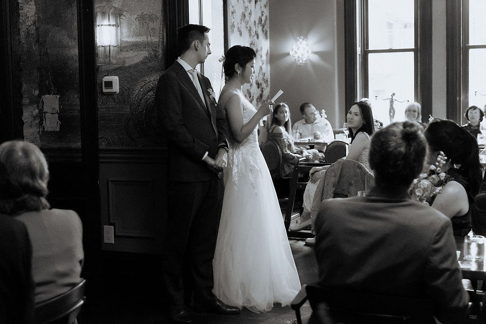 Black and white photograph of guests at the wedding dinner at Maison Selby.