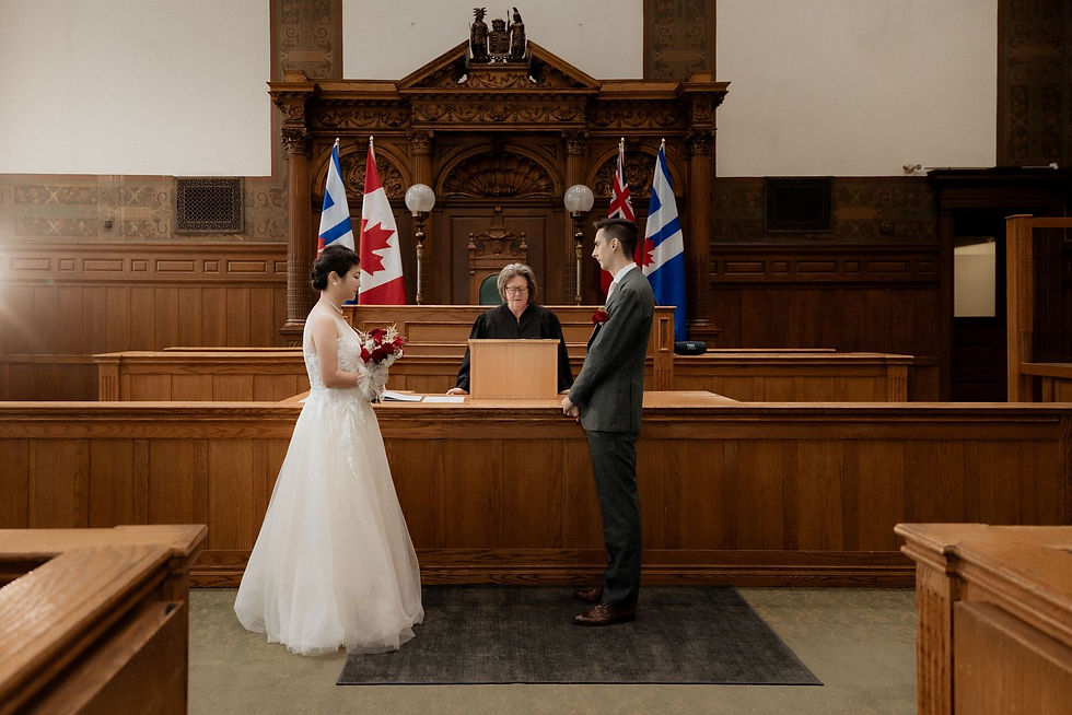 Guests seated either side of the couple during a civil ceremony in the Council Chamber at Old City Hall.