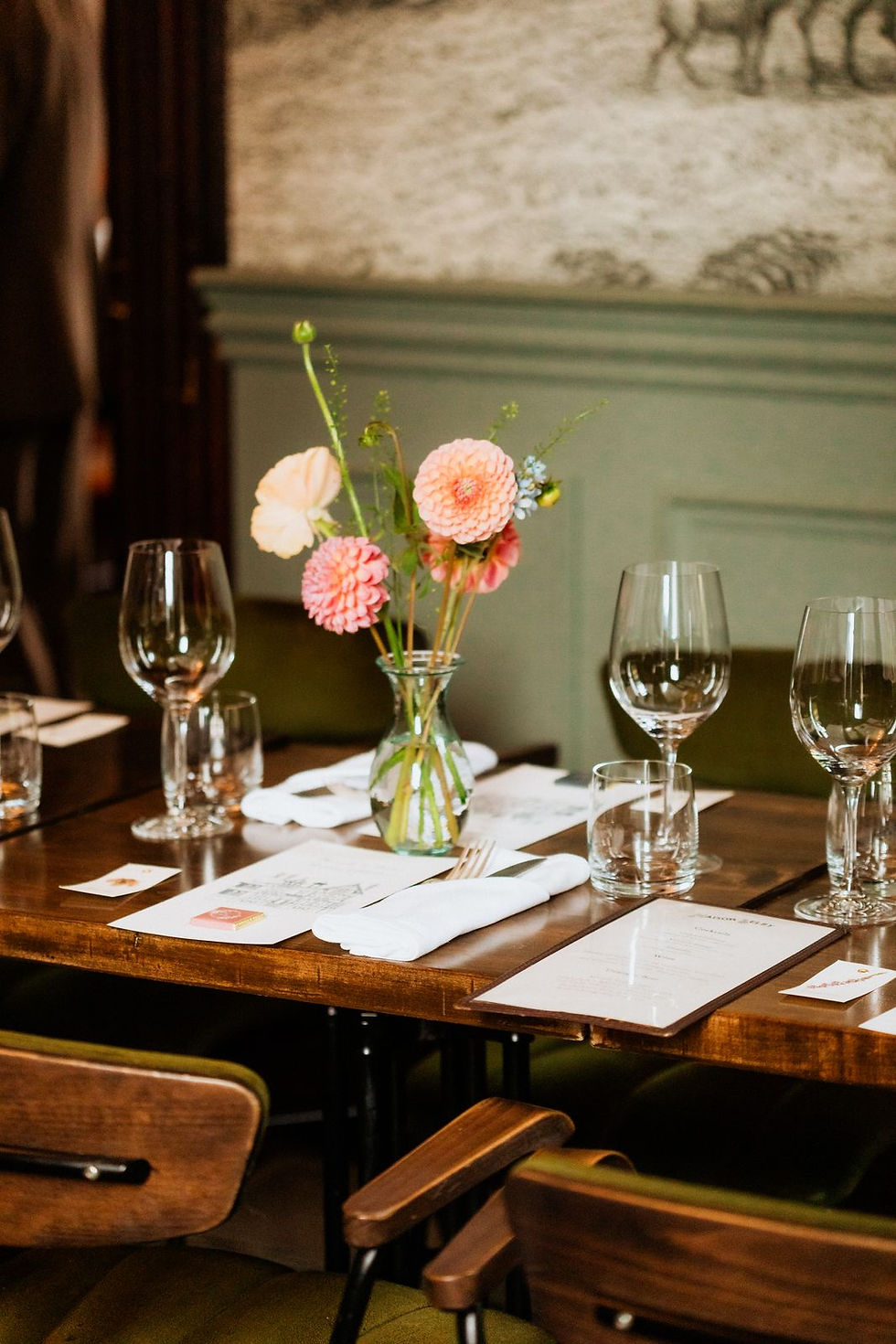 Wine glasses and flowers on the table at Maison Selby during a wedding dinner in Toronto.