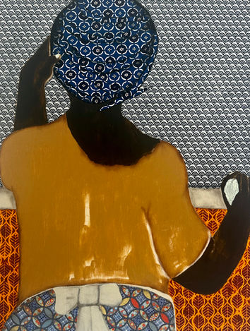 Woman (back view) looking out to sea