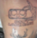 Tattoo artist portfolio near me: Skeleton hand holding mirror.