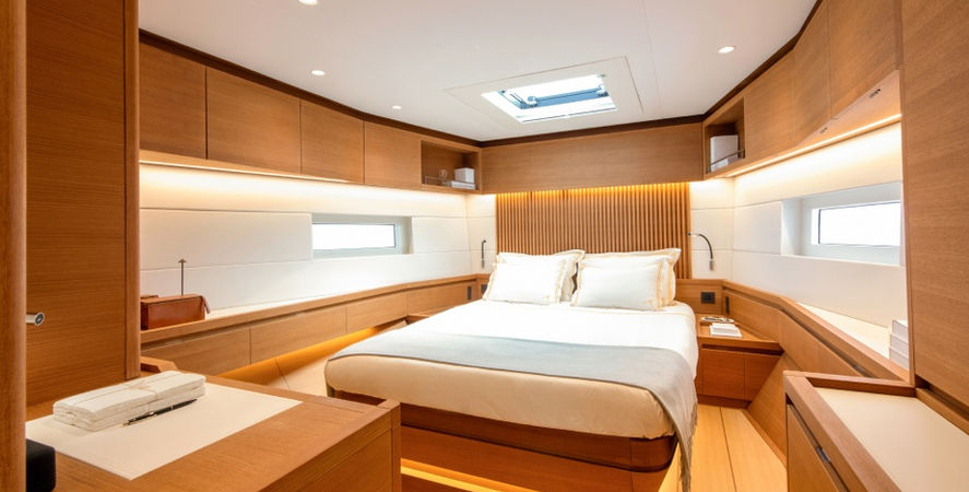 Bedroom with wooden interior and Finition Interior text. Cozy yacht bedroom interior.
