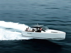 White motorboat speeding across water