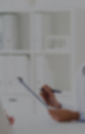 doctor-with-clipboard-and-woman-at-hospital-PFP5A87-r2_edited.jpg