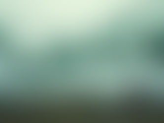 Sheets with green grid patterns flying in a Nordic wind while a woman sits on a rocky cliff watching.