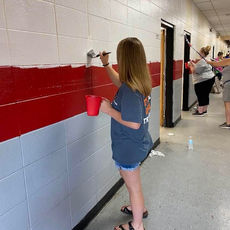 2022 Rogers Scholar Mackenzie McIntosh helps paint school building