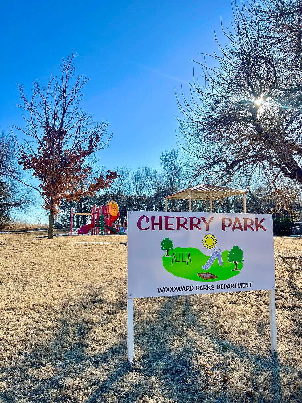Features: Playground, picnic table, and a park bench.