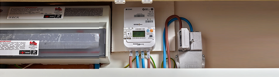 Smart meter installed next to a fusebox in a residential home