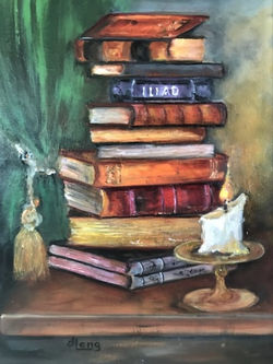 Old fashioned books with candlelight.