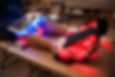 Legs with light therapy devices surrounding it.