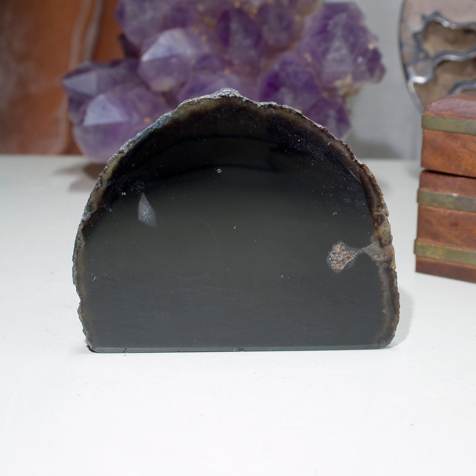 One side of this perfectly patterned Banded Agate is polished to reveal the concentric patterns inside, the reverse is left i