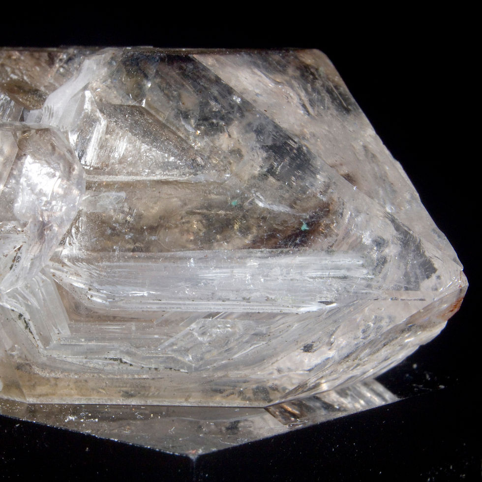 Thumbnail: Smoky Phantom Skeletal Enhydro Quartz. Whew! A nicely triangular space aligning with an upper facet contains a mobile enhydro
