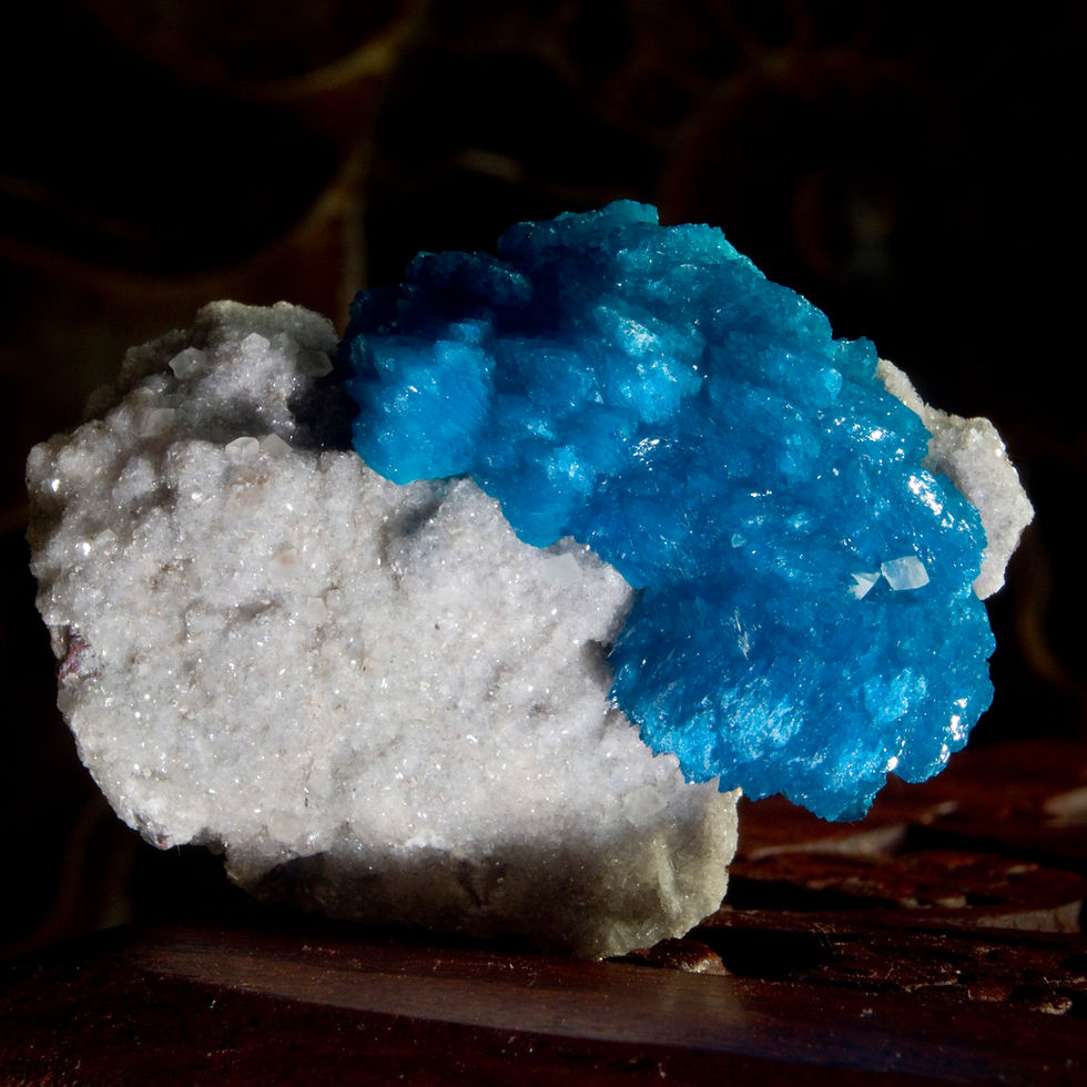 Thumbnail: A 1.25" crystal of Cavansite host two small, well protected crystals of Calcite. The Cavansite bisects the base of miniature