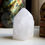 Thumbnail: Terminated milky Quartz, translucent with a soft natural light diffusion. Stands confidently on its own flat-sawn base. A per