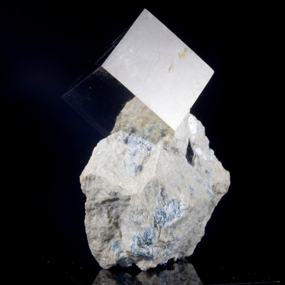 Thumbnail: An exceptionally balanced matrix specimen, one .5" cubic crystal of Pyrite perches high above the matrix which contains a sma