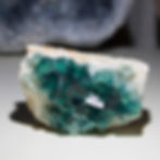 Deep Green crystals of cubic Fluorite that fluoresce a vibrant blue under UV light! Presents flat or upright without assistan