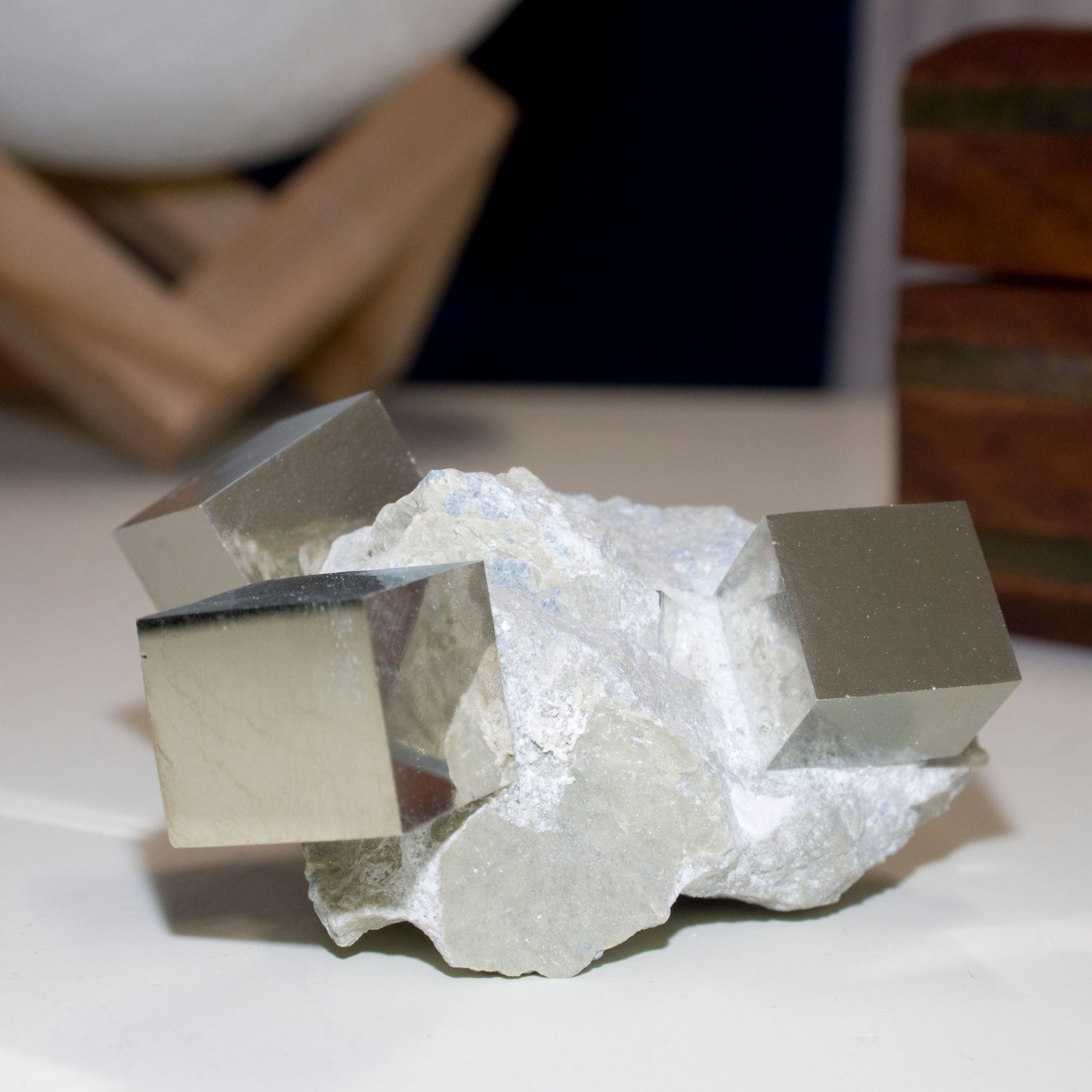 A carousel of three beautifully balanced crystals of lustrous cubic Pyrite on the Marl matrix in which they grew. This form a