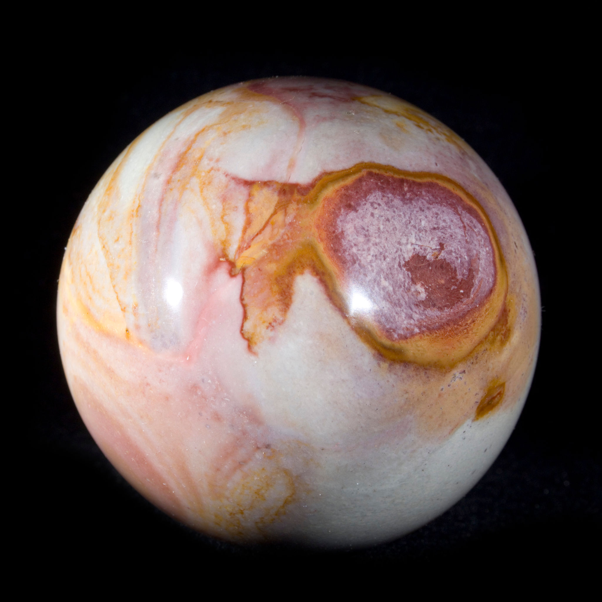 Swirls of color and earth tones create a beautiful, planetary atmosphere in these compelling, naturally patterned 2.25" spher