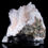 Thumbnail: A bright and lustrous cluster of pink Heulandite crystals in many scales, A base of white Mordenite provides a perfect contra