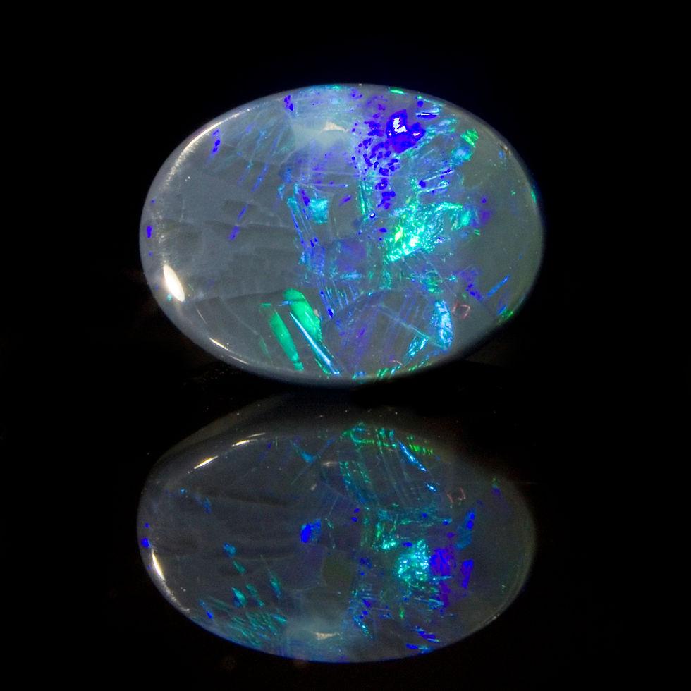 Thumbnail: The prismatic color bar of purple, blue and green leap from this Black Opal from Emu's Rush, Coocoran Fields, Lightning Ridge