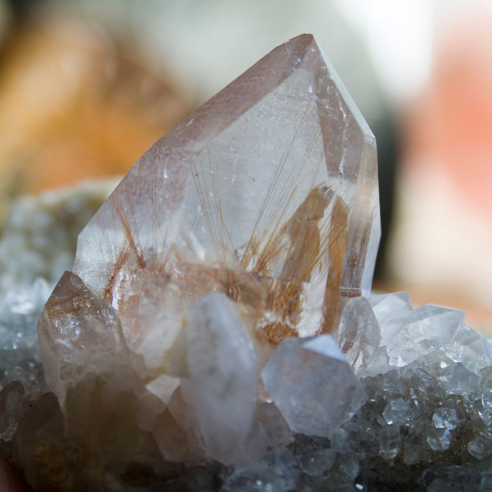 Himalayan Quartz crystal provide windows to sparkling Rutile within. A broad matrix, covered in Quartz, provides the perfect