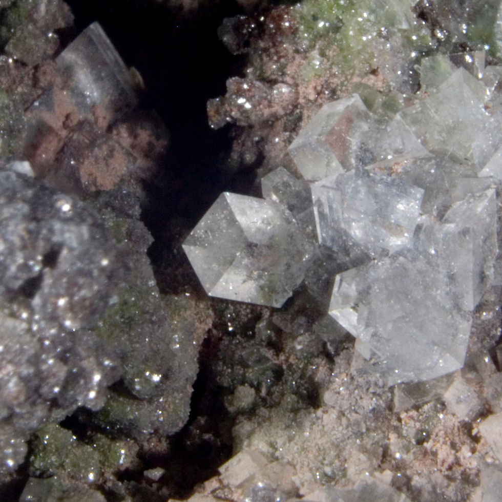 Thumbnail: NIcely clear rhombohedral crystals of Calcite on one side, Dolomite on the other with minor aspects of Duftite. An excellent
