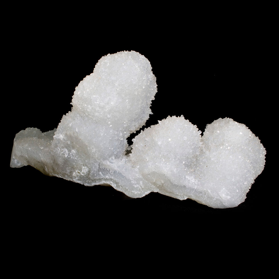 A wide base of sparkling small scale Quartz ornaments with multiple stalactites of Chalcedony. Studio Mineralia