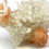 Thumbnail: Gravity Defying Calcite with Apophyllite and Stilbite on Chalcedony
