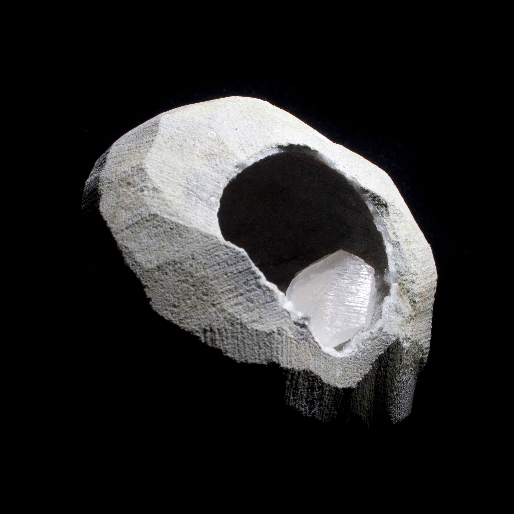 A natural Calcite crystal within a Basalt Geode. A crystal of Calcite formed in a naturally occurring internal space in basal