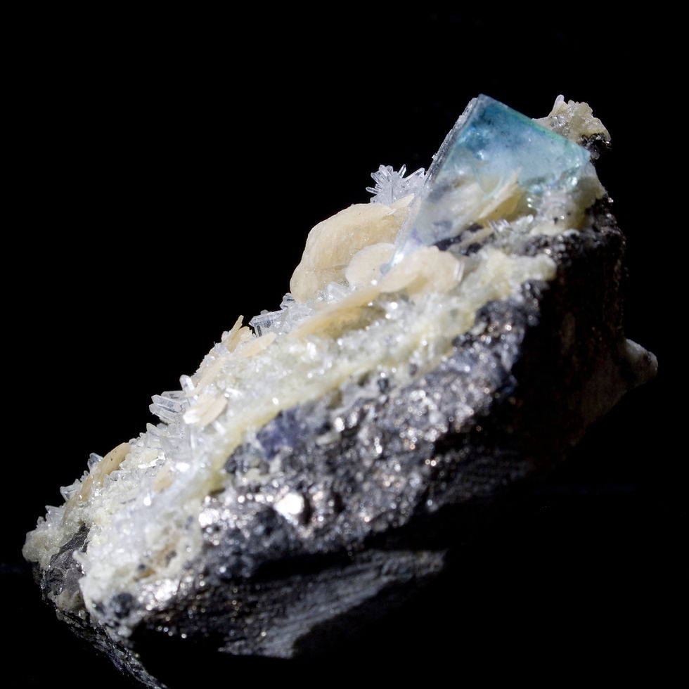 Fluorite with Quartz and Siderite. The fluorite has a nice blue-green to its clearest corner while the matrix is covered in