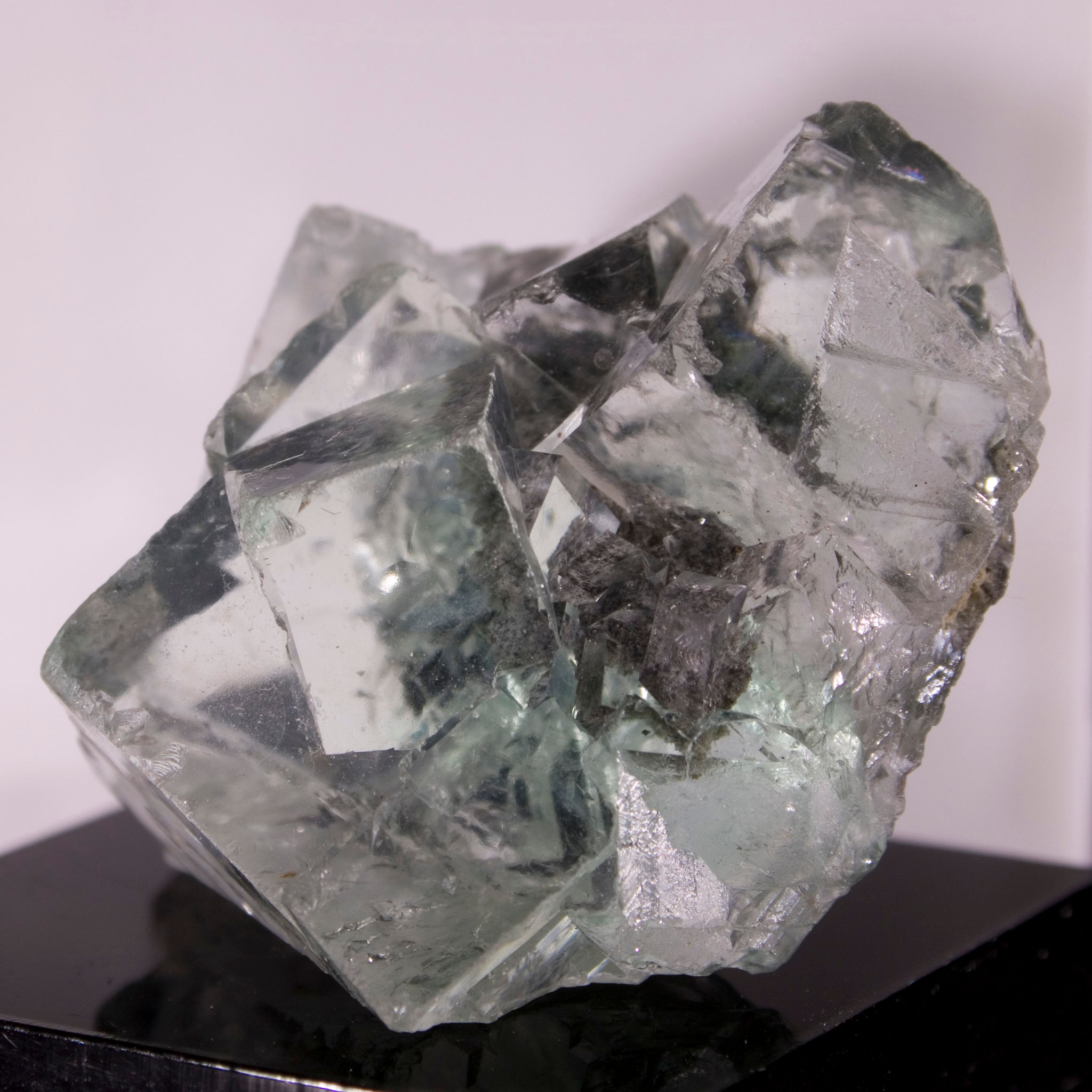 Astonishingly water clear, lightly etched green cubic Fluorite crystal cluster. A small matrix aspect is perfectly visible wi
