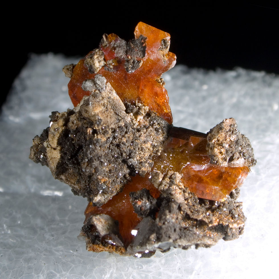 Uniquely dark orange Wulfenite crystals connected via matrix, highlight this spectacular matrix thumbnail from the legendary