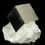 Thumbnail: A single, beautifully balanced, completely natural cubic crystal of lustrous Pyrite, perched on the Marl matrix in which it g