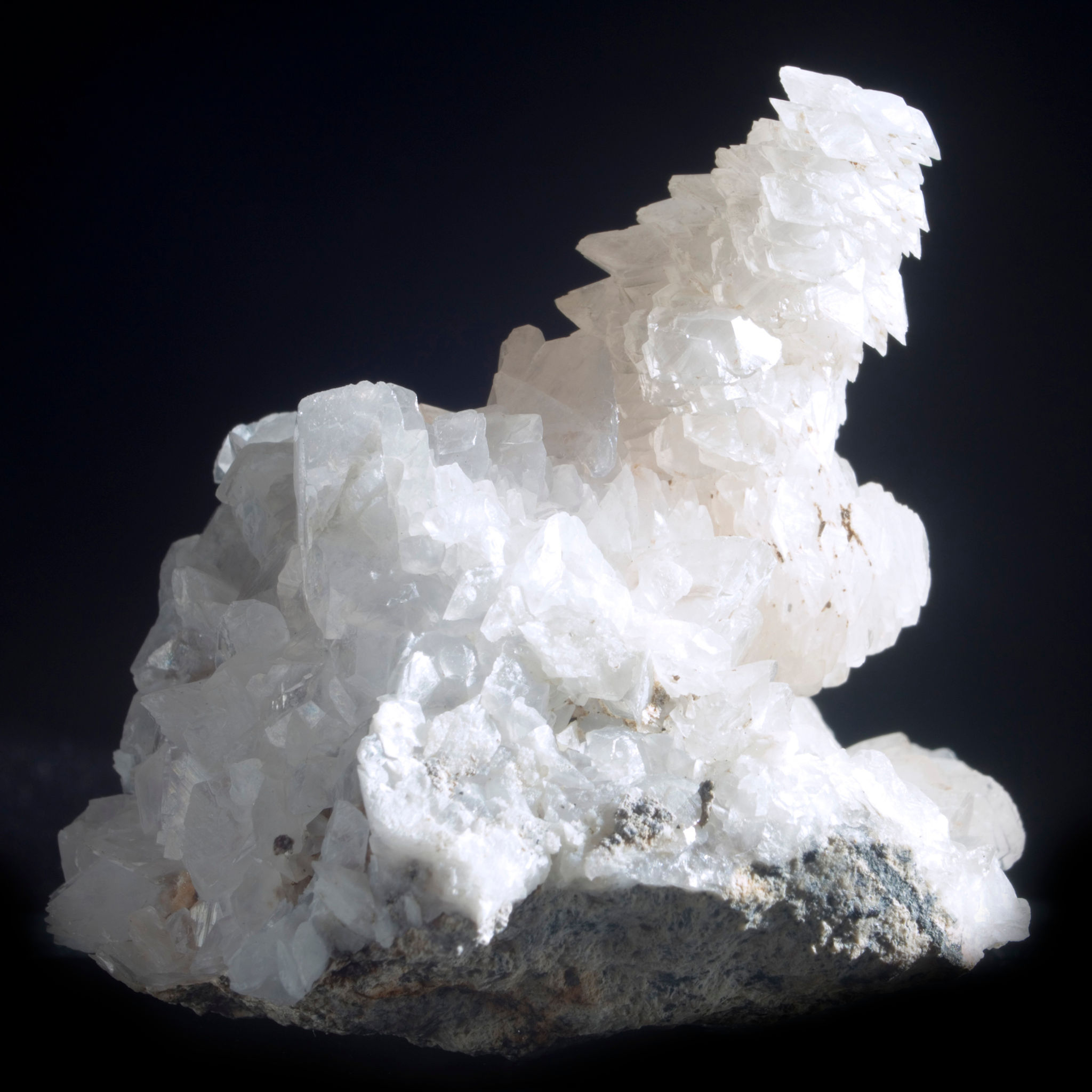 Freestanding small cabinet 'Pagoda' Calcite. A graceful series of flat Calcite crystals in descending size forming multiple c