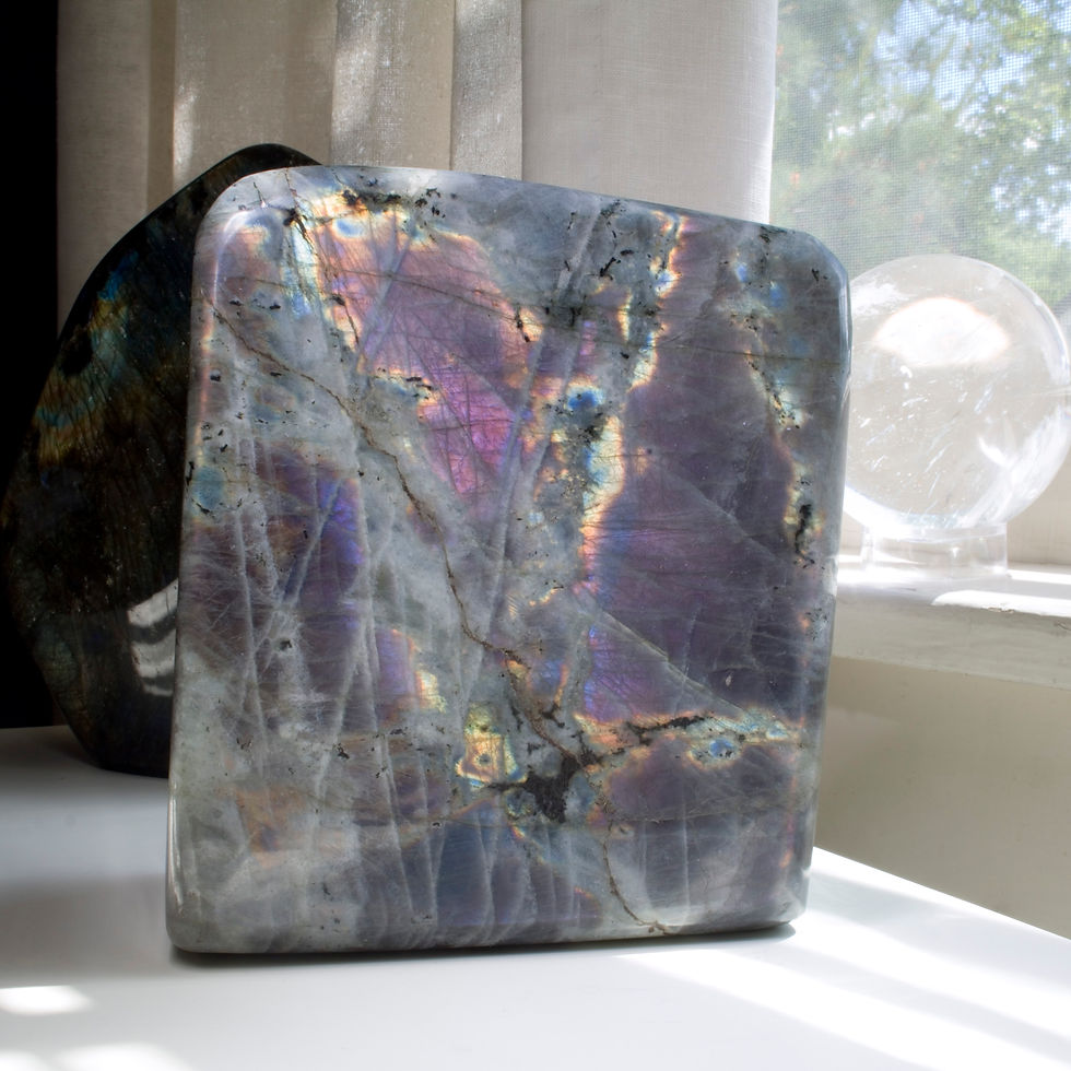 A massive, 7.5 pound monolith of rare purple-pink Labradorite, polished on all sides. Labradorite is a spectacularly iridesce