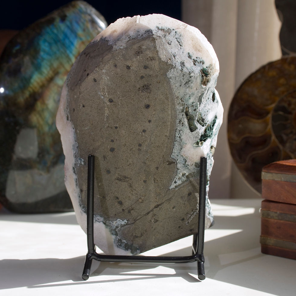 Thumbnail: Hematite provides a pop of color on this basalt-backed terminated Apophyllite geode presentation. Deep red highlights crystal
