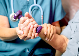 Nurse helps older patient lift weight for therapy with Medical Services for Seniors in Dallas, Texas | Geriatric Medicine | Celebration Senior Magazine | www.celebrationmagazine.com