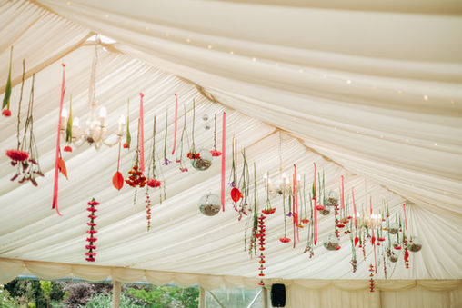 hanging flowers from marquee disco balls pink and orange
