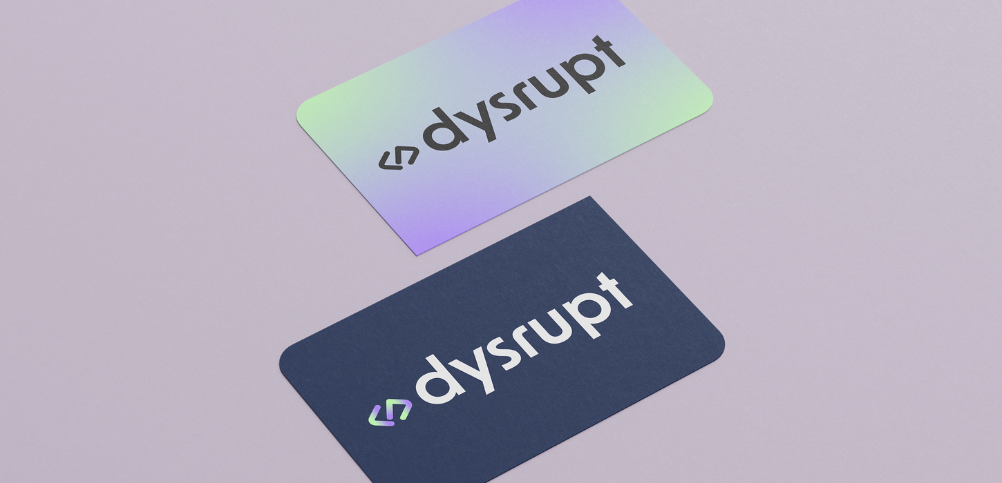 Two business cards on a light purple background. One card features a dark blue background with a white logo for the brand 'Dysrupt,' a software engineering company. The other card has a purple and green gradient background with a dark blue logo and an icon representing software engineering.