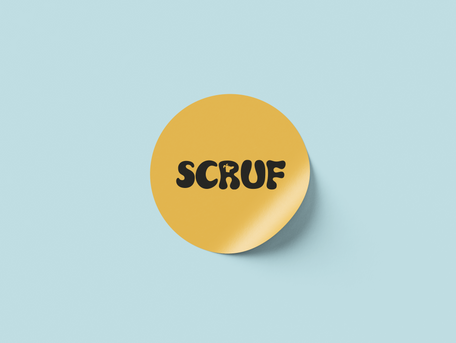 A yellow sticker with a logo for a company called Scruf with a cutout of a dog-head in the R