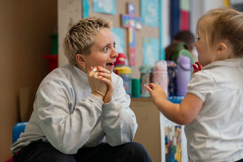 Lily making a nursery student laugh