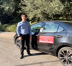 Daniel in front of car edited.png