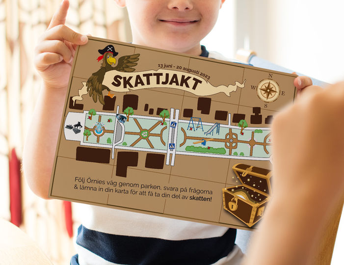 child holding treasure map