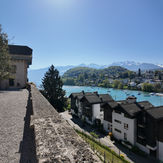 Turquoise lake, waterfront homes, and mountains