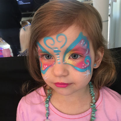 Pretty butterfly face art in Norwalk CT. She looks so cute with butterfly face paint