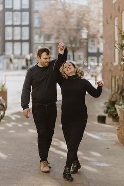 Couple dancing in the street in Amsterdam in love photoshoot