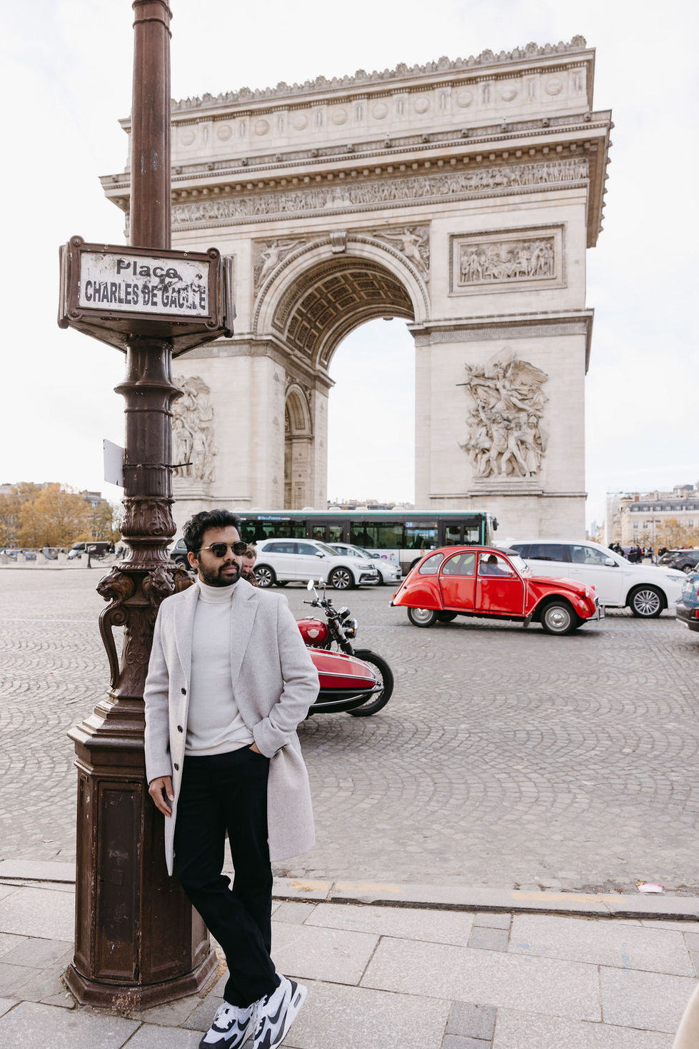 Vacation photo of solo traveler at Arc de Triomphe by professional Paris photographer