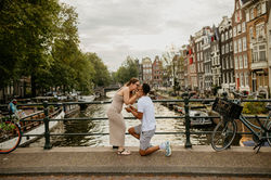 Man proposing on the bridge in Amsterdam captured by Photographer