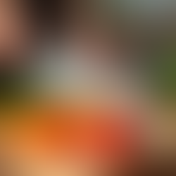 Person chopping fresh vegetables on a cutting board in a well-lit kitchen prep zone, Coeur d’Alene by Dovetail Contracting.