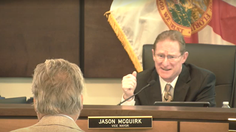 Vice Mayor & Zone 3 Commissioner Jason McGuirk compliments Natural Resources Manager Ralph “Tony” Miller on a job well done during the City Commission’s public meeting on April 14, 2026